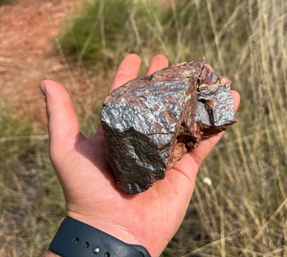A person holding a rock AI-generated content may be incorrect.
