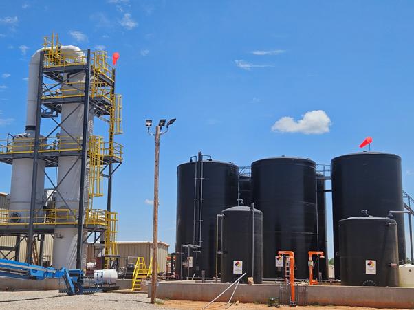 A large black silos in a factory AI-generated content may be incorrect.