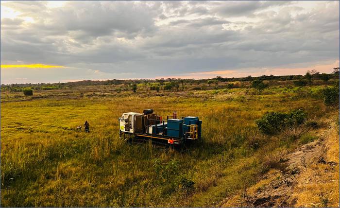 A truck in a field AI-generated content may be incorrect.