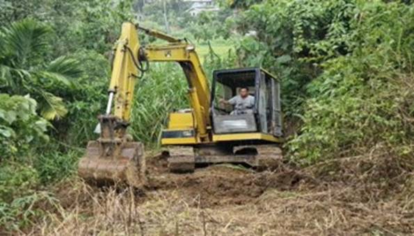 A person driving a bulldozer AI-generated content may be incorrect.