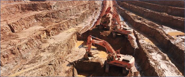 A construction site with excavators working AI-generated content may be incorrect.