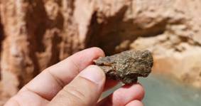 A person holding a rock AI-generated content may be incorrect.