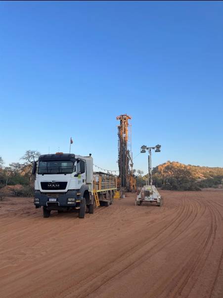 A truck parked in a dirt field AI-generated content may be incorrect.