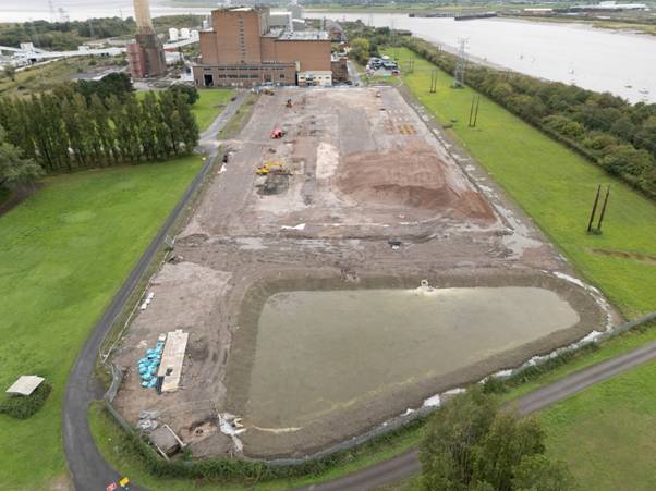 A construction site with a body of water AI-generated content may be incorrect.