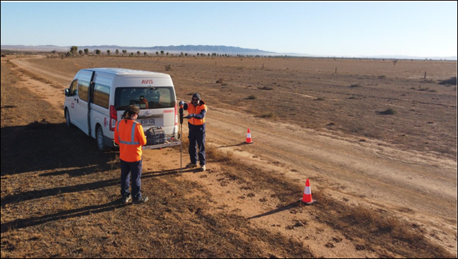 A group of people standing next to a van AI-generated content may be incorrect.