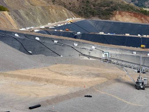 A large quarry with a large pile of sand AI-generated content may be incorrect.