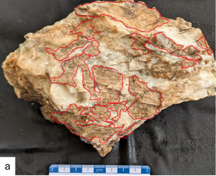 A rock with red lines on it AI-generated content may be incorrect.