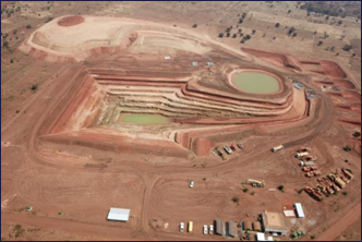 A large area of dirt with a pond AI-generated content may be incorrect.