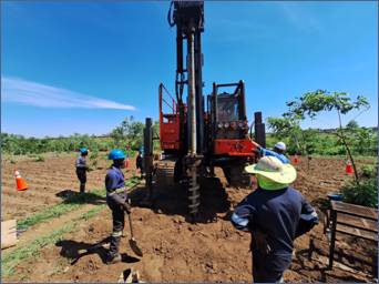 A group of people working in a field AI-generated content may be incorrect.