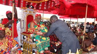 A person in a traditional dress holding a person's hand AI-generated content may be incorrect.