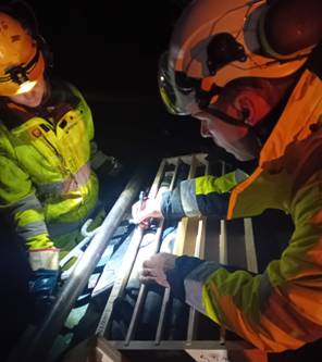 A group of men wearing safety gear AI-generated content may be incorrect.