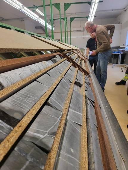 A person standing next to a person standing next to a person standing next to a person standing next to a person standing next to a person standing next to a person standing next to a person standing next AI-generated content may be incorrect.