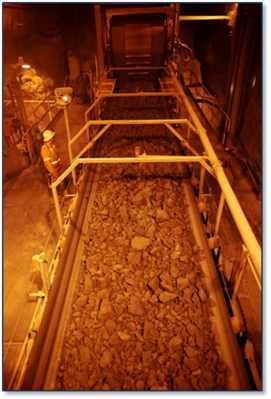 A person standing next to a conveyor belt AI-generated content may be incorrect.