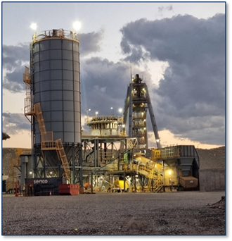 A large factory with a large silo AI-generated content may be incorrect.