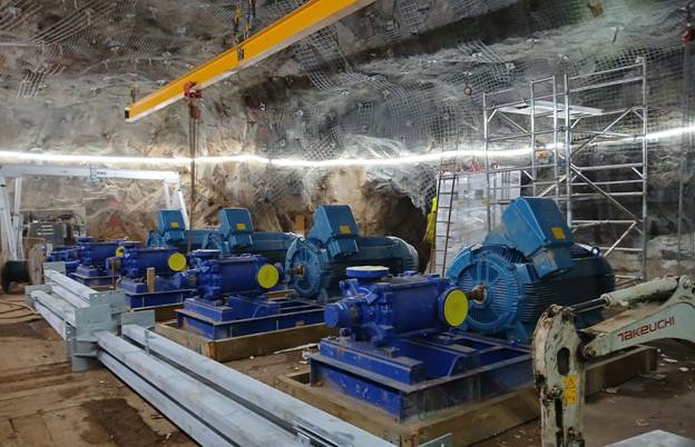 A group of blue machines in a cave AI-generated content may be incorrect.