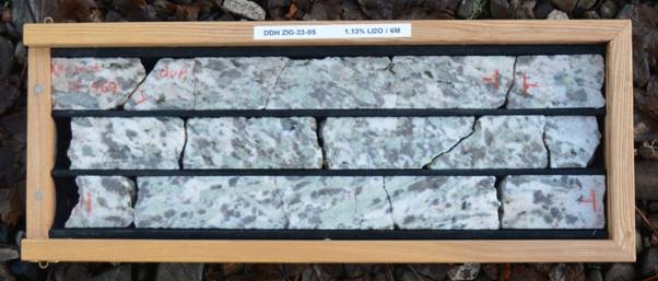 A rectangular frame with a black border and a white and grey stone with black stripes AI-generated content may be incorrect.