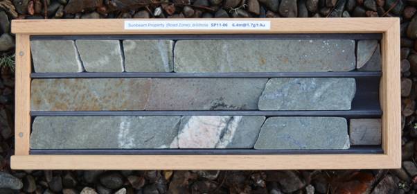 A rectangular frame with a group of stones in it AI-generated content may be incorrect.