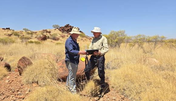 A couple of men in a desert AI-generated content may be incorrect.