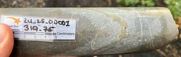 A hand holding a stone object AI-generated content may be incorrect.