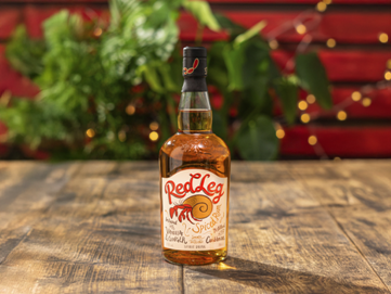 A bottle of alcohol on a table AI-generated content may be incorrect.