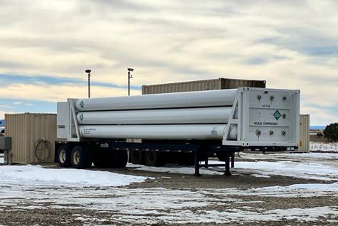 A trailer with a large white tube Description automatically generated with medium confidence