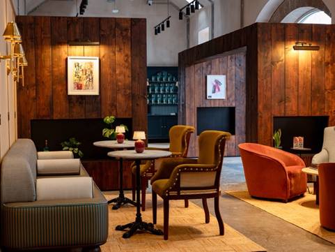 A room with a couch and chairs AI-generated content may be incorrect.