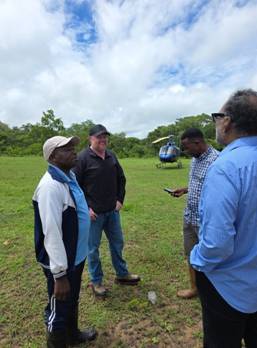A group of men standing in a field
