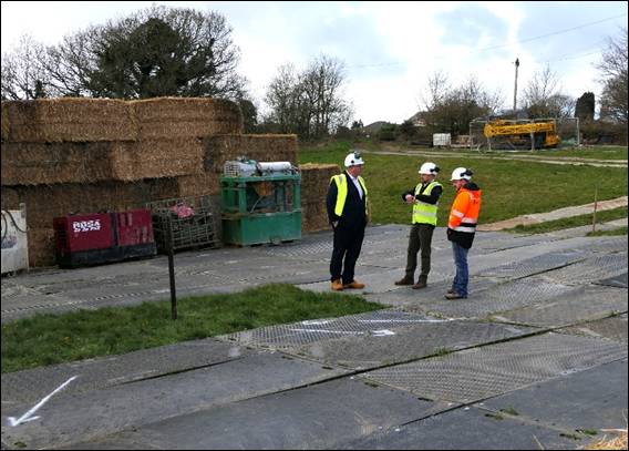 A group of men wearing safety vests and helmets AI-generated content may be incorrect.