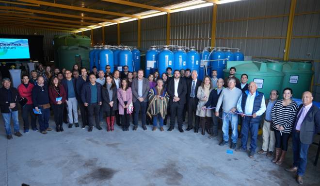 A group of people standing in a warehouse AI-generated content may be incorrect.