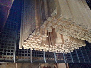A bunch of paper in a metal rack AI-generated content may be incorrect.