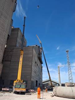 A construction site with cranes AI-generated content may be incorrect.
