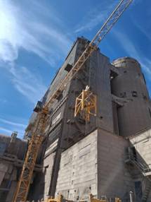 A crane on a building AI-generated content may be incorrect.
