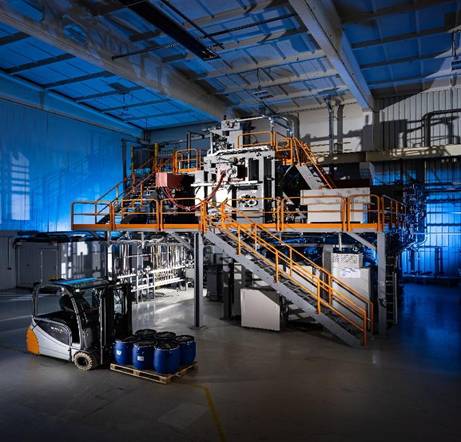 A large industrial plant with a staircase Description automatically generated with medium confidence