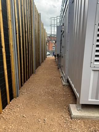 The acoustic fence alongside the genset enclosures