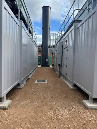 View between the two genset enclosures towards the exhaust stack